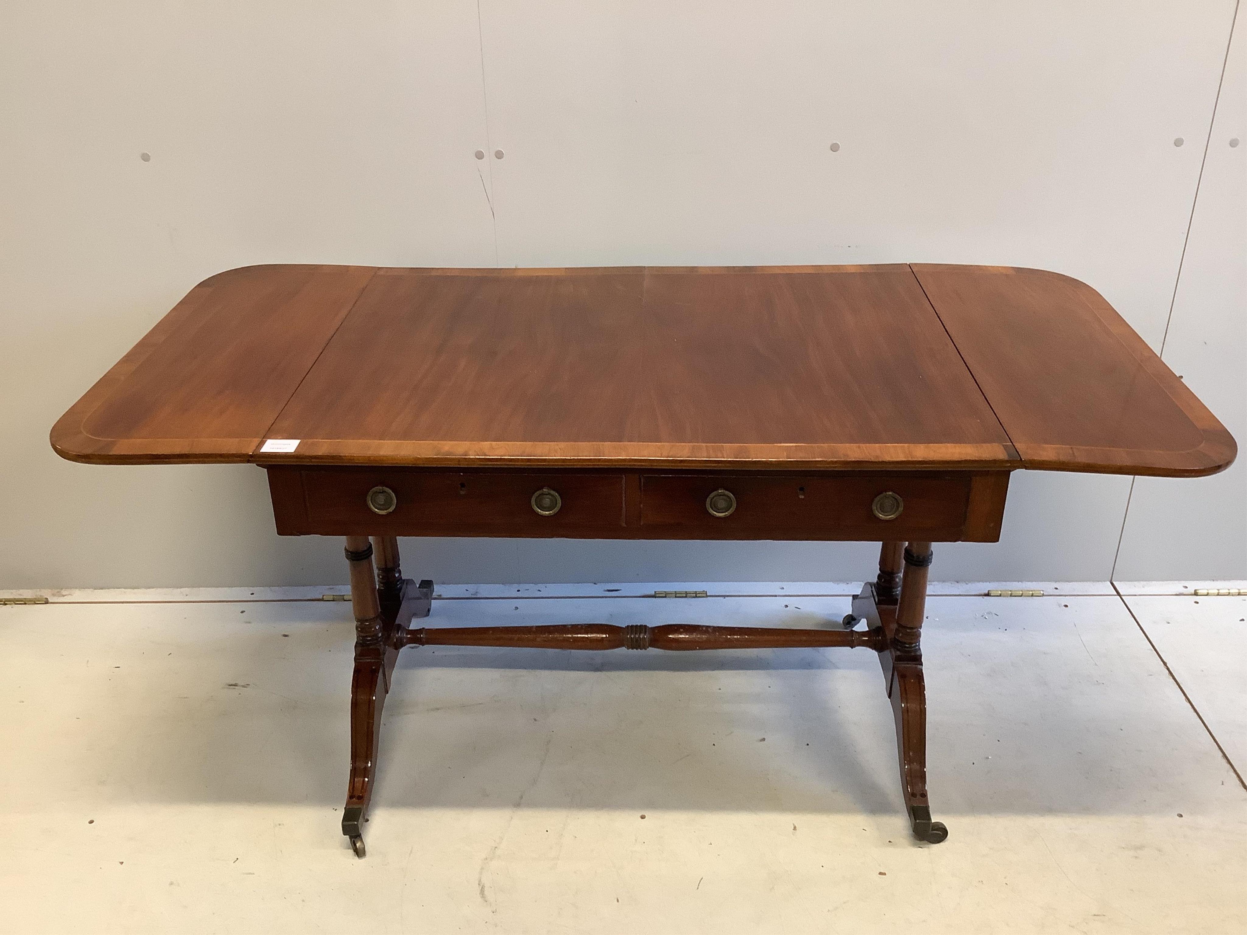 A Regency banded mahogany sofa table, width 94cm, depth 70cm, height 70cm. Condition - fair